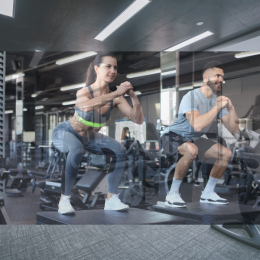a couple working out in a gym